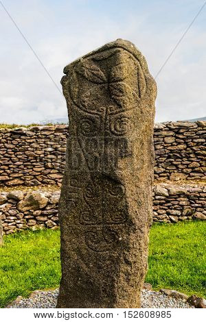 The Ogham Standing stone located at Reask Monastery, County Kerry, Ireland.  Ogham is an alphabet that appears on monumental inscriptions dating from the 4th to the 6th century AD,