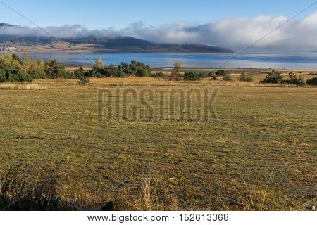 Low clouds over water of Batak Reservoir, Pazardzhik Region, Bulgaria