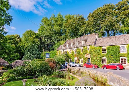 BIBURY UNITED KINGDOM - AUGUST 08: This is the Swan hotel in Bibury town in the Cotswolds area. This is one of the main hotels in the area where many tourists stay on August 08th 2016 in Cotswolds