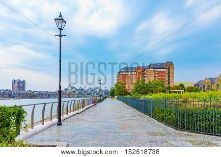 walking path along the river thames in the evening