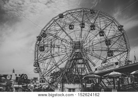 summer day in coney island amusement park with the wonder wheel