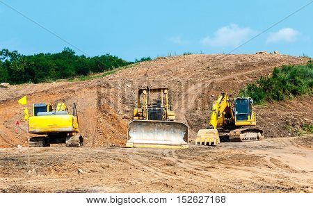 Closeup skid steer loader excavator at road construction work