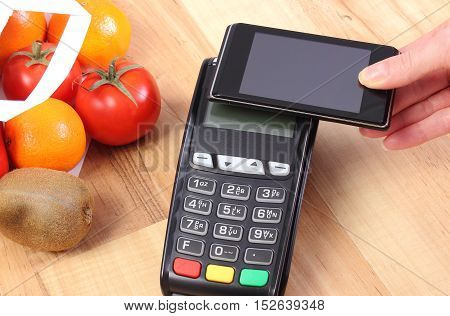 Payment Terminal And Mobile Phone With Nfc Technology, Fruits And Vegetables, Cashless Paying For Sh