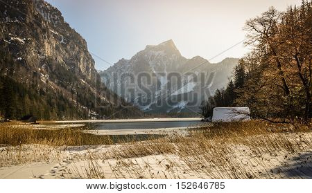 Winter landscape with mountain lake. Leopoldsteinersee, Styria, Austria.