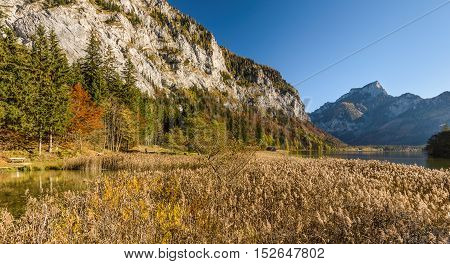 Autumn landscape with mountain lake. Leopoldsteinersee Styria, Austria.