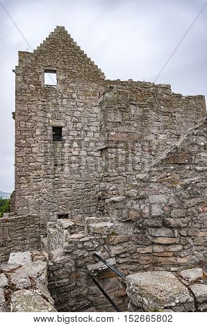 A spooky view of Craigmillar Castle ruins in the Scottish capital city of Edinburgh.