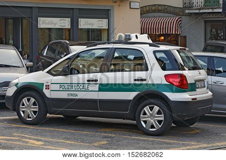STRESA ITALY - SEPTEMBER 24: Police car in a small luxury town Stresa by the lake Lago Maggiore Italy on September 24 2016