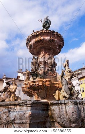 Ancient fountain of Neptune (fontana del Nettuno 1767-1769) in the square of cathedral (Piazza del Duomo) in Trento Trentino Italy