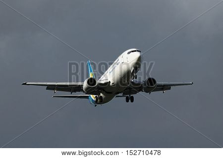 Borispol Ukraine - September 3 2010: Ukraine International Airlines Boeing 737 landing with stormy sky on the background