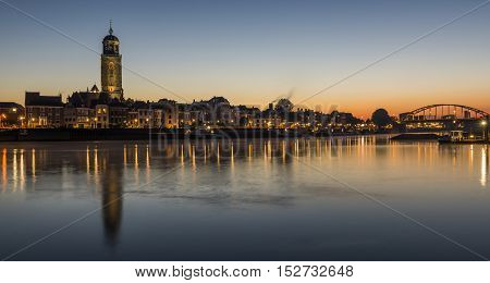 Deventer at the IJssel in the morning during blue hour with the Great Church or Lebuinukerk and Bridge in the province Overijssel The Netherlands.