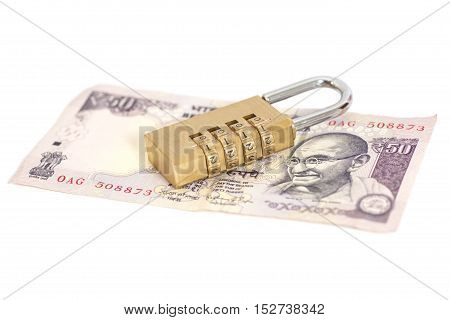 Combination padlock on Indian currency rupee isolated on white