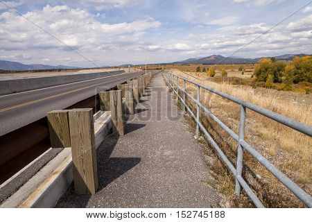 The walking path and road over the Jackson Lake Dam