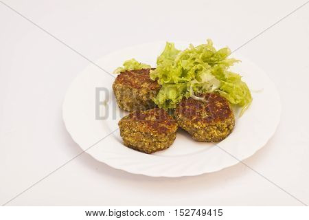 vegetarian cutlets with fresh salad on white plate