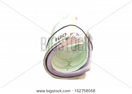 Euro banknotes under rubber band isolated on white
