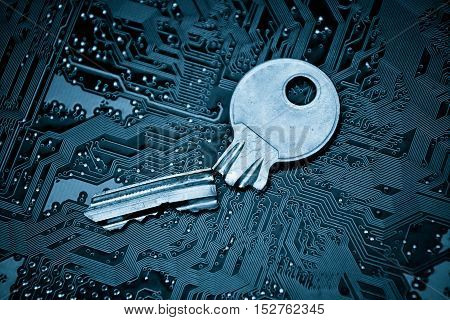 A broken key on computer circuitboard background / computer security breach concept