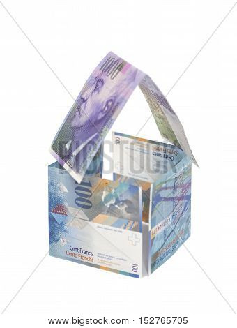 House Made of Swiss francs banknotes isolated on white.Currency of Switzerland