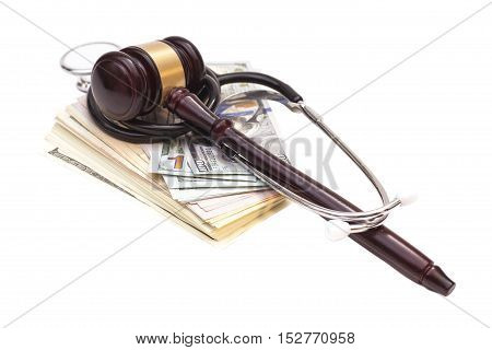 Stethoscope with judge gavel and dollar banknotes on white background