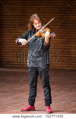 Silver Spring, USA - September 17, 2016: Vasyl Popadiuk virtuoso playing violin during Ukrainian festival performance