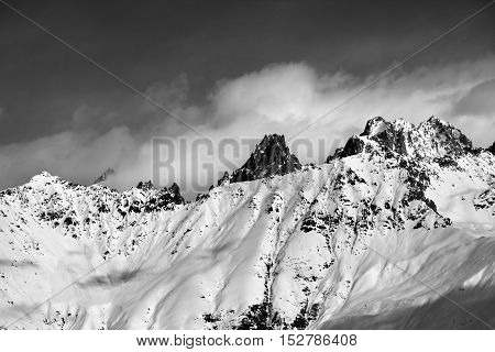 Black And White Snow Avalanches Mountainside In Clouds