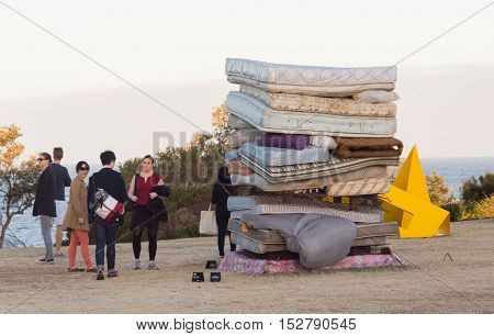 5 November 2013: Bondi Beach, Sydney, Australia - People Looking At Stack Of Mattresses Exhibit At S