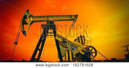 Industrial Oil Pump against sky  in red  tones