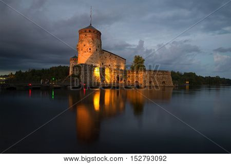 The medieval fortress in the town of Savonlinna on august night. Finland