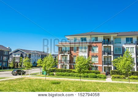 Brand new low rise apartment building on sunny day in British Columbia Canada