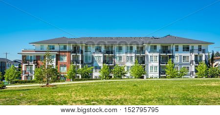 Brand new apartment building on sunny day in British Columbia Canada