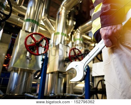 Industrial Worker With Spanner At Factory Workshop
