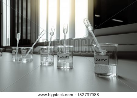 Solution in beakers with dropper science laboratory