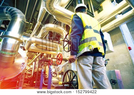 Industrial Worker With Spanner At Factory