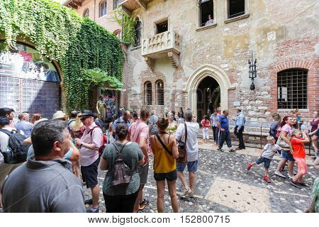 VERONA ITALY- September 08 2016: Tourists near house of Juliet Capulet (Giulietta Capuleti) with balcony made famous by William Shakespeare love tragedy Romeo and Juliet