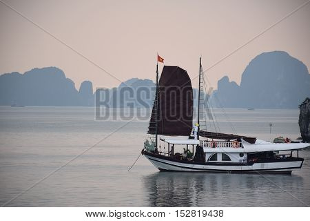 Tourist junk floating in Halong bay, Vietnam