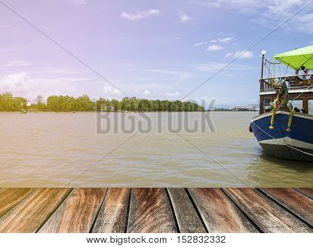 pier wood floor beside sea with blue sky background. summer relaxing time.