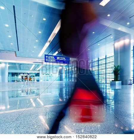 Passengers in the airport terminal motion blur movement.