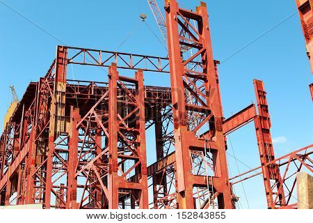 Building of the Plant with working crane
