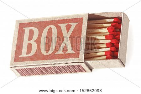 Matches in a matchbox. Isolated on white background. Soft focus.