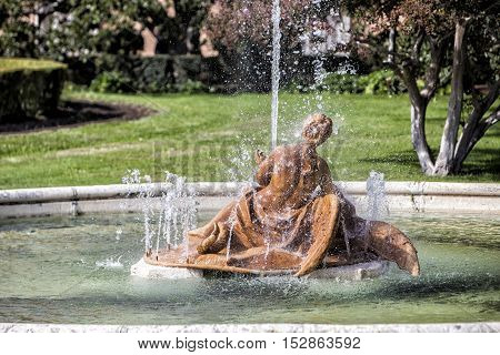 Aranjuez Spain - October 16 2016: Beautiful fountain near the Royal Palace of Aranjuez located in the Royal Site and town of Aranjuez UNESCO World Heritage site Madrid province Spain