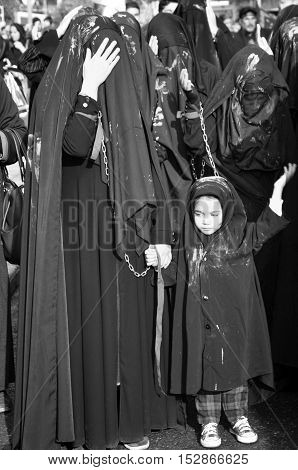 Istanbul Turkey - October 11 2016: Muslims worldwide marks Ashura Istanbul Shiite community. Turkish Shia Muslims mourning for Imam Hussain. Caferis take part in a mourning procession marking the day of Ashura in Istanbul's Kucukcekmece district Turkey on