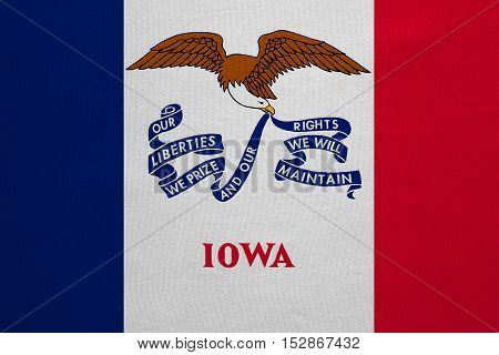 Flag of the US state of Iowa. American patriotic element. USA banner. United States of America symbol. Iowan official flag with real detailed fabric texture illustration. Accurate size colors