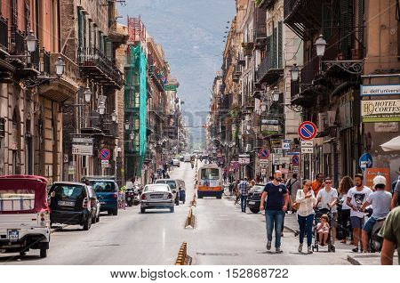 PALERMO ITALY - SEPTEMBER 7 2015: Pedestrians walking by via Maqueda famous street in old city centre of Palermo Sicily Italy.