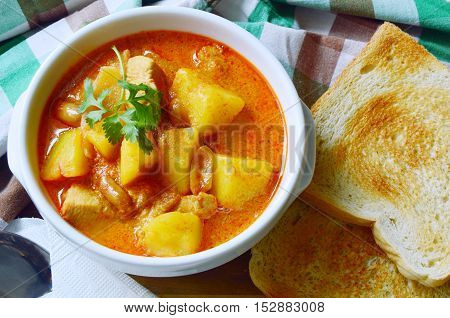 Chicken Mussaman Curry (Thai food menu) with toast.