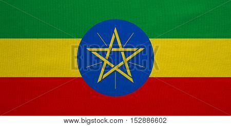 Ethiopian national official flag. African patriotic symbol banner element background. Correct colors. Flag of Ethiopia with real detailed fabric texture accurate size illustration