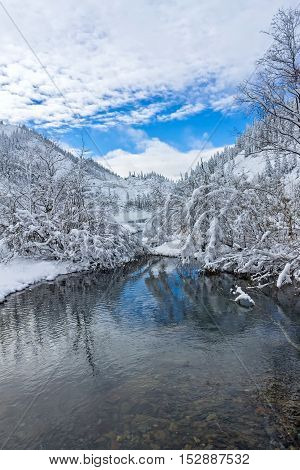 Beautiful lake Amut in taiga hills on Far East of Russia in early october. Mountain lake in winter. Beautiful nature.