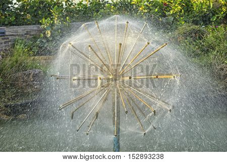 automatic watering on marco background in park - can use to display or montage on product