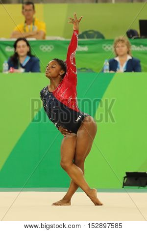 RIO DE JANEIRO, BRAZIL - AUGUST 7, 2016: Olympic champion Simone Biles of United States competes on the floor exercise during women's all-around gymnastics qualification at Rio 2016 Olympic Games
