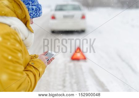Woman in winter calls to the emergency services