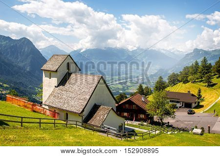 Beautiful rural scene in Triesenberg village with mountains in Liechtenstein