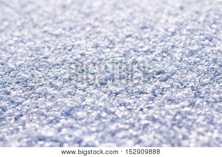 Glittering violet blue snow texture macro, shallow depth of field