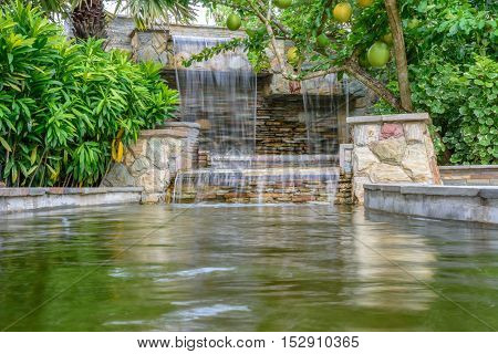 The landscape of beautiful waterfall in garden